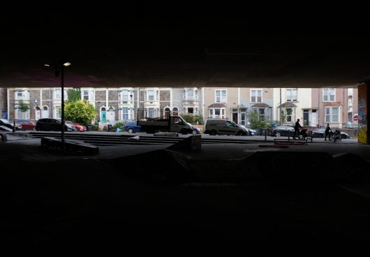 life squeezed between pavement and flyover